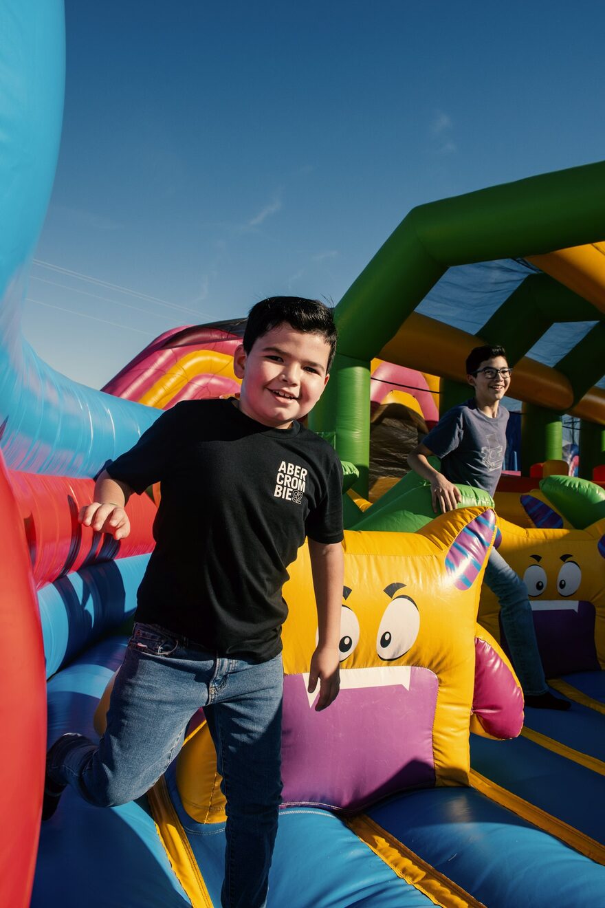A jumper on a colourful cartoon bouncy castle