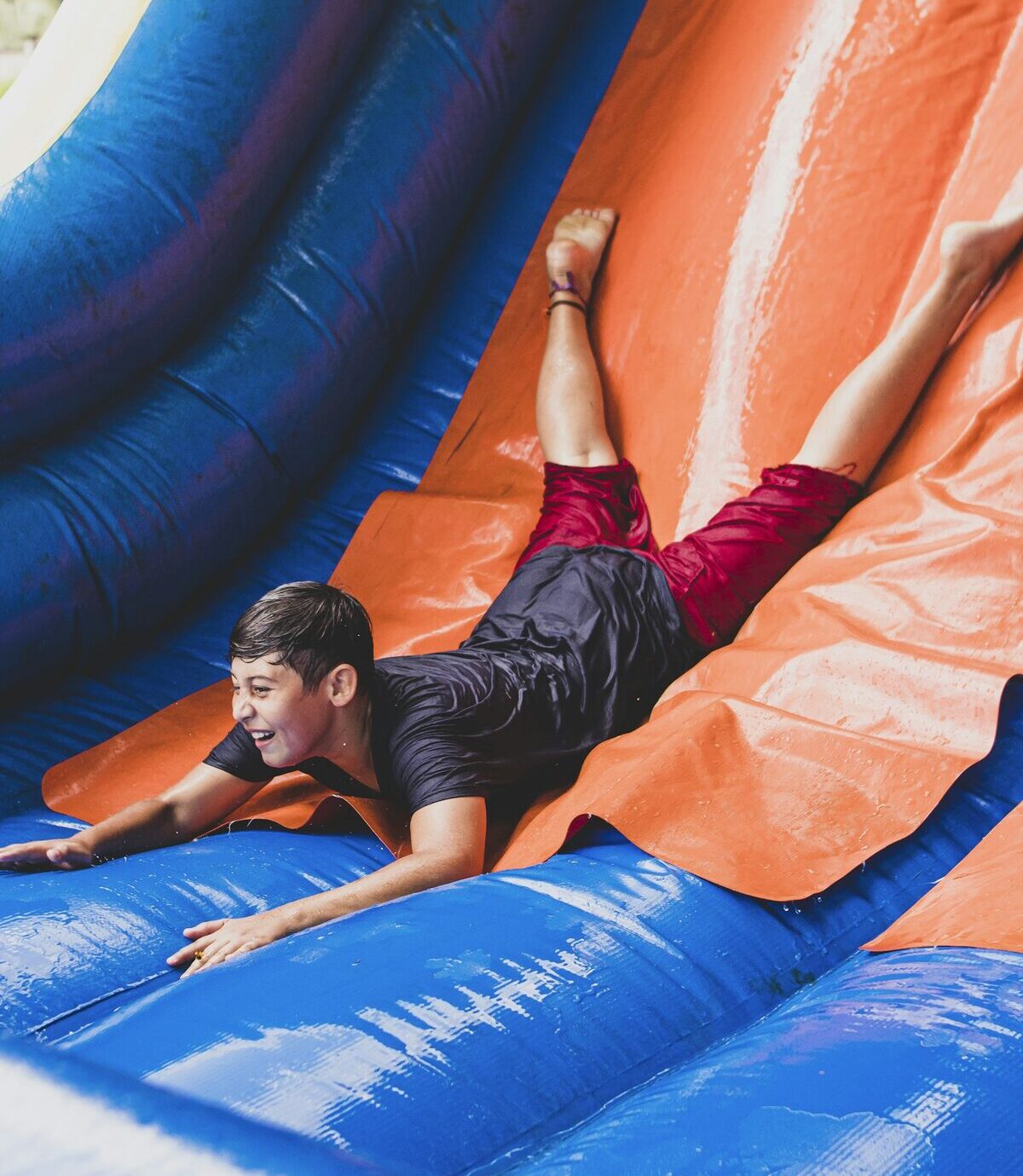 Full speed down the big orange water slide